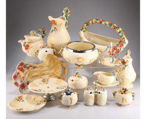 AN EXTENSIVE COLLECTION OF CLARICE CLIFF CELTIC HARVEST WARES including four jugs; a teapot; various preserve pots; biscuit b