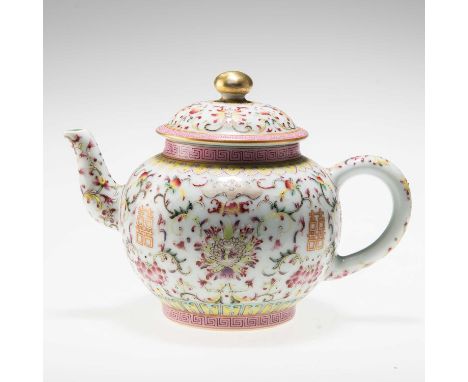 A CHINESE FAMILLE ROSE 'LOTUS' TEAPOT enamel painted with scrolling foliage, bears iron-red seal mark. 11.5cm highCirca 1900