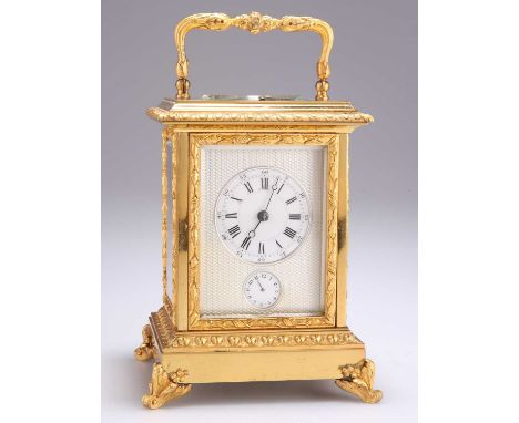 A 19TH CENTURY FRENCH BRASS REPATING ALARM CARRIAGE CLOCK the dial with Roman and Arabic numerals, alarm set dial and engine 