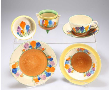 A GROUP OF CLARICE CLIFF BIZARRE CROCUS PATTERN WARES comprising A CAULDRON; A TEACUP, SAUCER AND SIDE PLATE; A PIN DISH; and