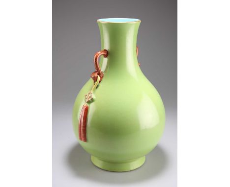 A CHINESE GREEN-GLAZED PEAR-SHAPED VASE, YUHUCHUNPING with ruyi sceptre form handles, bears seal mark in iron-red. 31.5cm hig