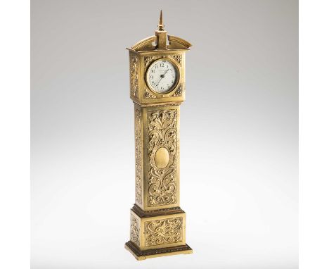 A MINIATURE BRASS LONGCASE CLOCK the cream enamel dial signed Macmichael, 42 South Audley St W. 45cm high
