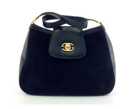 A vintage Gucci navy blue suede and leather handbag with goldtone hardware and double G logo to the closure. Labelled inside 