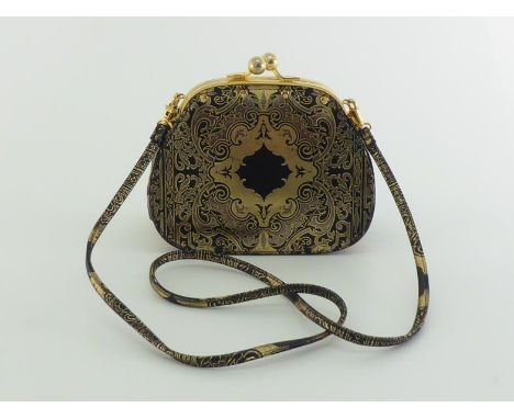 A Gianfranco Ferre evening bag with gold Baroque leather exterior and snap closure, detachable strap for use as a clutch bag.