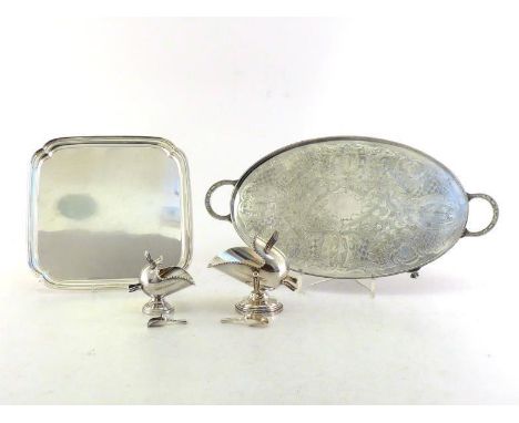 A group of silver plated items comprising:- a shaped square salver on scroll feet, 30 cm. wide; two sugar scuttles, one on gi