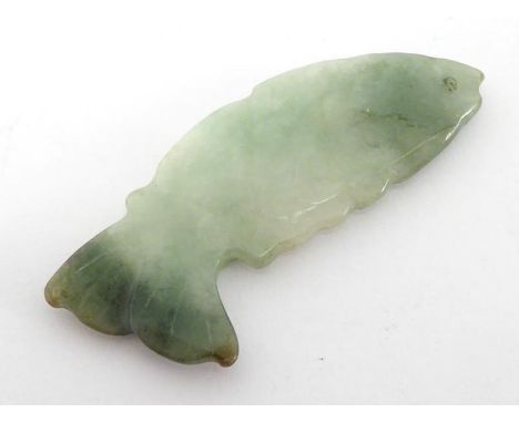 A carved jade fish pendant, 4cm. long. 