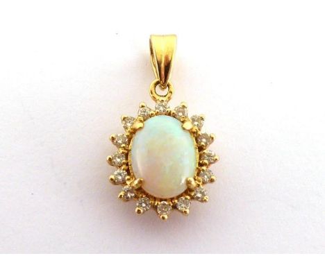 An opal and diamond pendant, the central opal 9 x 7mm, in a surround of small brilliants, the bale stamped '750', 2.4gms COND