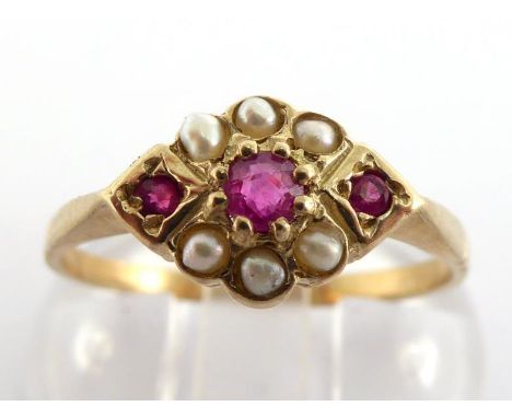 A ruby and seed pearl ring, the small cluster 11mm wide, the shank stamped '9ct', finger size N/O, 1.6gms CONDITION: no losse