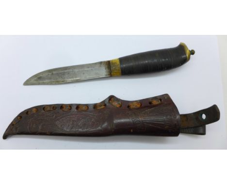 A Norwegian dagger with leather scabbard, the blade marked S.&amp;S. Helle, Holmedal, Norge