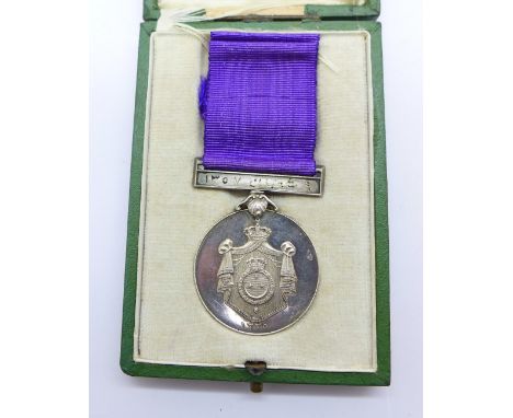 An Egyptian medal, boxed, the box marked Mon. J. Lattes, Le Cairo