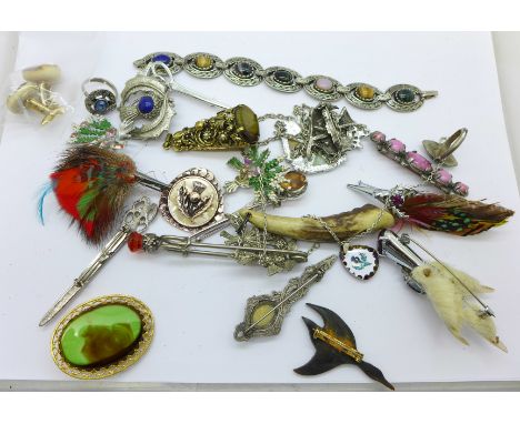 Celtic style brooches, a carved antler whistle, etc.
