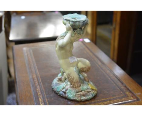 A 19th century majolica figure of a kneeling Pan, originally a comport or centrepiece, now converted to a lamp (chips). 29.5c