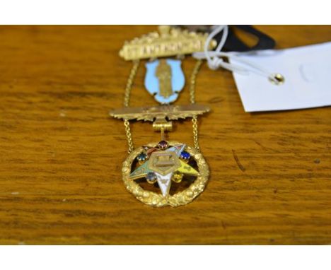 A 9ct gold Masonic breast jewel, Order of the Eastern Star, the top bar with thistle surmount above a figure of St. Anthony a
