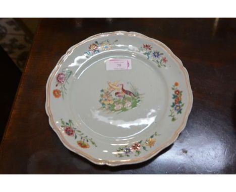 A Chinese Export porcelain plate, enamel painted in the famille rose palette with a vignette of birds, the rim with floral sp