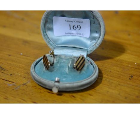 A pair of gentleman's diamond-set 9ct gold studs; together with a pair of 14ct gold and enamel cufflinks, oval.