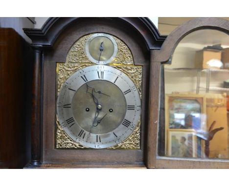 A late George III oak longcase clock, the silvered chapter ring with Roman numerals enclosing subsidiary dials and signed Nic