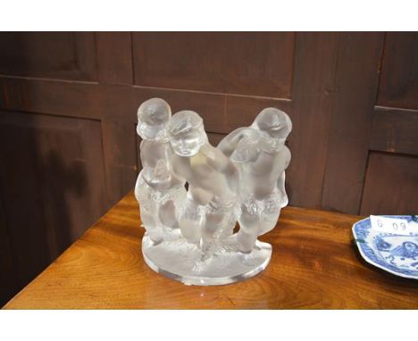 A Lalique "Luxembourg" figure group, of three cherubs holding a floral garland, on a semi-circular base, engraved "Lalique Fr