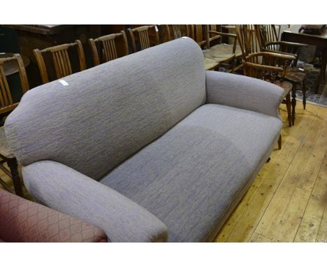 A late Victorian mahogany framed sofa, the turned legs moving on castors. Length 180cm