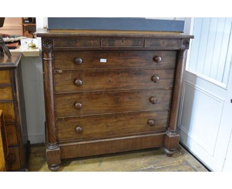 A Victorian mahogany "Scotch" chest of drawers, the overhanging rectangular top with two frieze drawers, over four graduated 