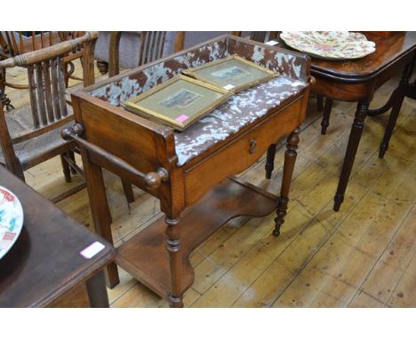 A Victorian marble-topped oak washstand, the rouge and white marble galleried top above a frieze drawer, raised on turned leg