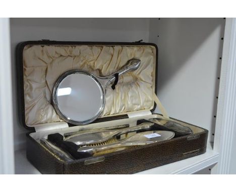 A George V cased six piece silver-backed dressing table set, Daniel Manufacturing Co., Birmingham 1923 (comb lacking silver m