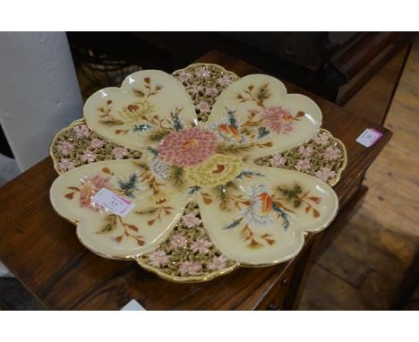 A Hungarian Zsolnay Pecs porcelain charger, c. 1900, reticulated and moulded, painted with floral sprays and highlighted with