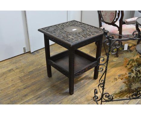 An unusual carved oak occasional table, early 20th century, the square top carved in high relief with Scottish symbols includ