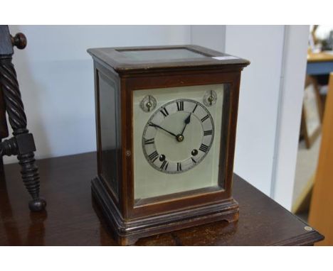 An early 20th century mahogany cased bracket clock, the silver dial with Roman numerals and two subsidiary dials, the eight d