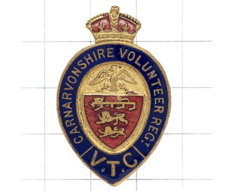 Welsh. Carnarvonshire Volunteer Regt WWI VTC lapel  badge Brass and red enamel.  Buttonhole Stress marks to shield. GC 