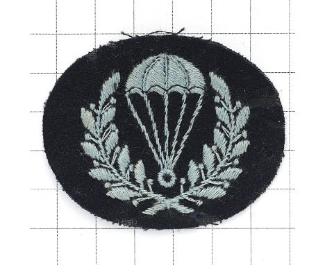 RAF Parachute Instructor’s scarce WW2 1st pattern cloth badge. Light blue parachute resting in laurel wreath embroidered on b
