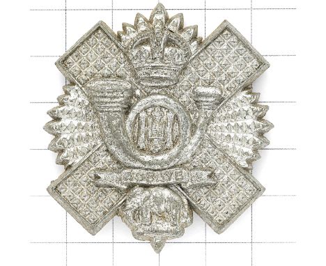 Scottish. Highland Light Infantry WW2 plastic economy HLI glengarry badge Thistle star bearing crown, coiled bugle with HLI, 