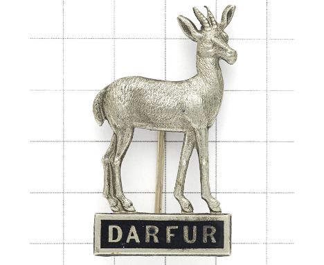 Africa. Sudan, Darfur Province Police 1930’s white metal cap / pagri badge. Gazelle standing on a black enamel tablet ‘DARFUR