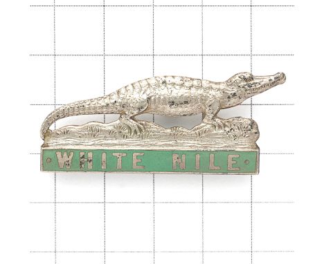 Sudan. White Nile Province 1930’s white metal cap / pagri badge. British made die-stamped Crocodiie on green enamel ‘WHITE NI
