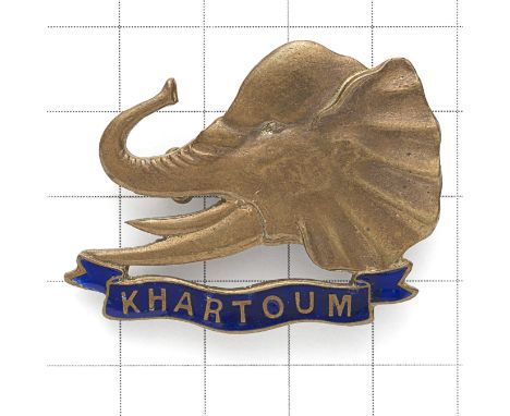 Sudan. Khartoum Province Police 1930’s brass cap / pagri badge. Elephant’s head resting on blue enamel ‘KHARTOUM’ scroll.  To