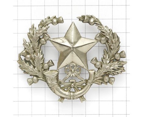 Cameronians (Scottish Rifles) Sergeant’s scarce glengarry badge.  Large die-stamped white metal Mullet over strung bugle with