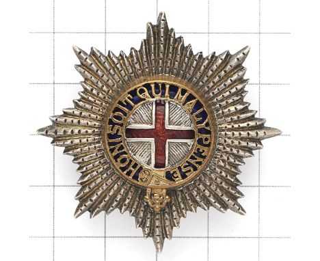 Coldstream Guards Warrant Officer’s cap star. A fine die-stamped facetted silvered Garter  Star; the gilt Garter pierced with