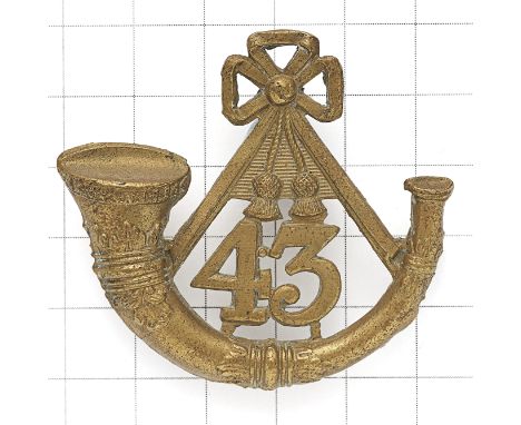Welsh. 43rd (Monmouthshire Light Infantry) Regiment OR’s glengarry badge circa 1874-81. Die-stamped brass strung bugle with 4