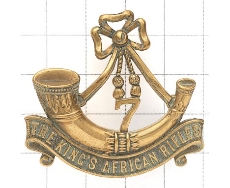 7th King’s African Rifles scarce Officer’s cap badge. Die-cast gilt strung bugle on ‘THE KINGS AFRICAN RIFLES’ scroll, ‘7’ lo