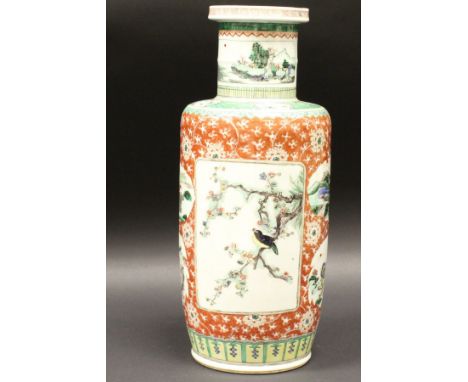 A 20th Century Chinese polychrome decorated vase of cylindrical form, the main body decorated with panels of birds amongst bl