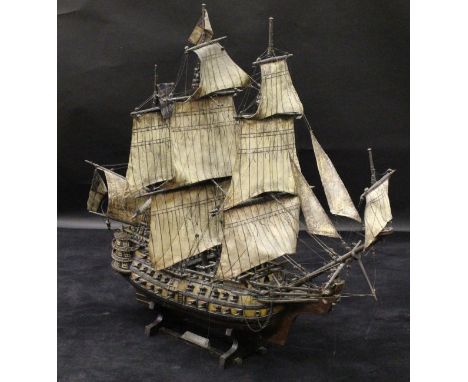 A painted wooden scale model of "The Victory", the sails of painted sail cloth, the rigging of rope and twine, approx 115 cm 