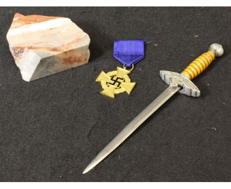 A collection of Third Reich memorabilia relating to Adolf Hitler, including a paper knife in the form of a Luftwaffe Officer'