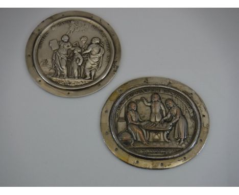 Two Charles II Christ's Hospital cloak badges with figural decoration, one, silver, inscribed "Avspicio Carol Secvnid Regis 1