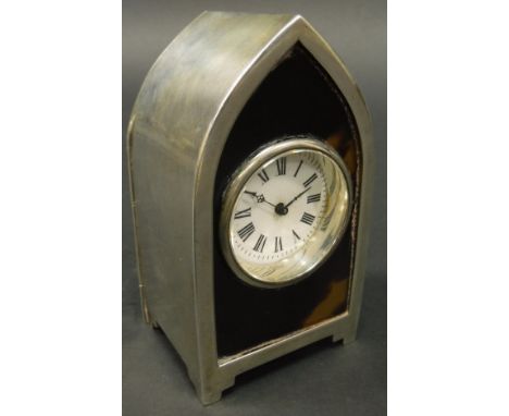 A Victorian silver cased and tortoiseshell mounted mantle clock of lancet form raised on stepped bracket feet, the movement w