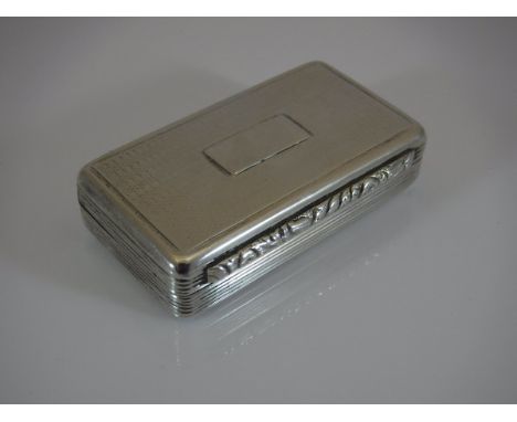 A William IV silver snuff box of rectangular form with engine turned and fluted decoration opening to reveal a gilt washed in