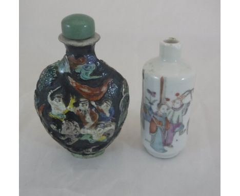 A 19th Century Chinese porcelain cylindrical snuff bottle, polychrome decorated with figures in an interior, 7.5 cm high, tog