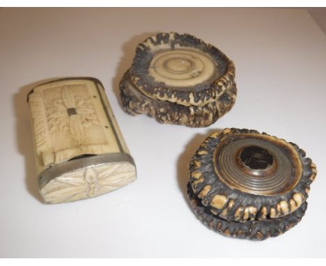 A 19th Century carved bone and metal mounted snuff box, a cut antler lidded snuff box with medallion inscribed "JW" and anoth
