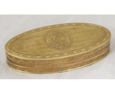 An early 19th Century yellow metal snuff box of oval form, the whole with floral medallion and striped engraved decoration, o