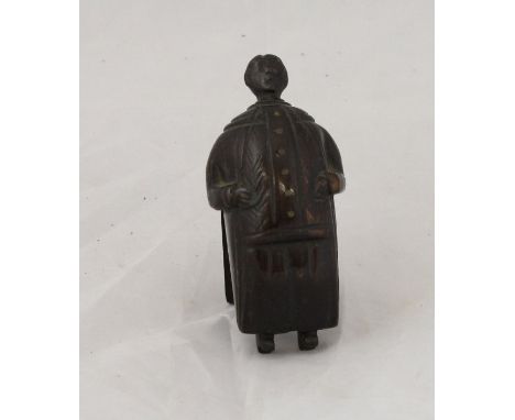 A late 18th or early 19th Century carved treen ware snuff box of figural form depicting a gentleman in long tailed coat, his 