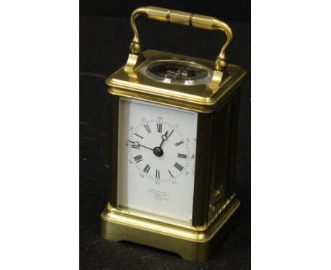 A circa 1900 brass cased carriage clock, the movement by Drocourt, bearing stamp verso, inscribed to backplate "11336 Repousé