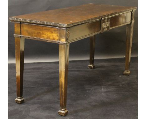 A circa 1900 mahogany serving table in the Adam taste, the plain top with carved edge over a plain frieze with central urn pa